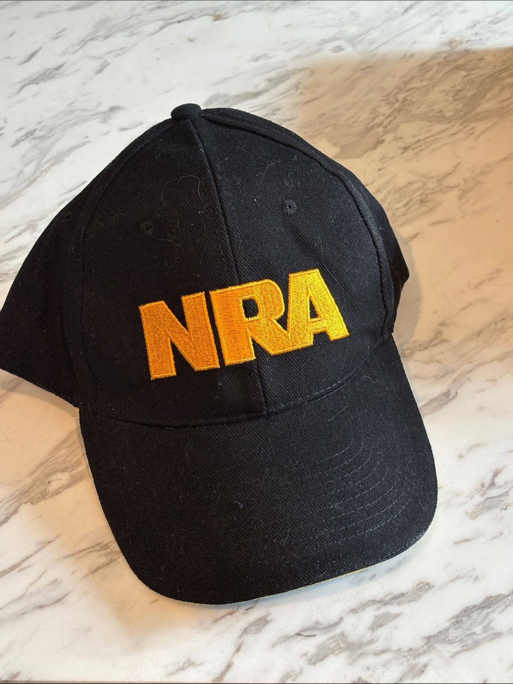 Black Baseball Cap with Bold Yellow 'NRA' Embroidery